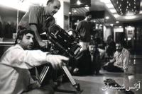 عزیز ساعتی و ابراهیم حاتمی کیا در پشت صحنه آژانس شیشه ای